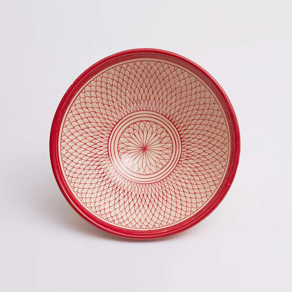 Moroccan Safi red salad bowl with grey background.