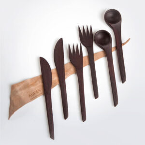 Wooden utensil set with grey background.