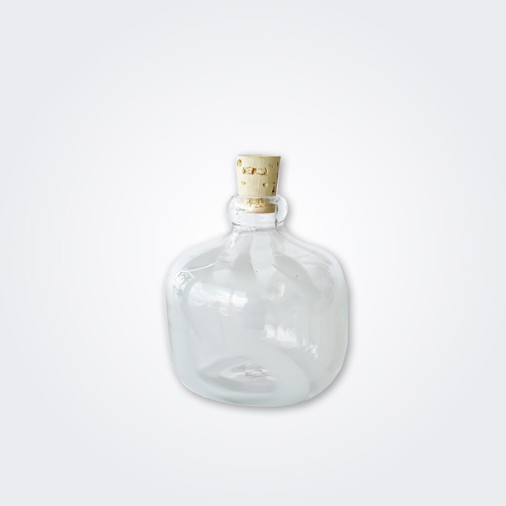 Small white glass carboy