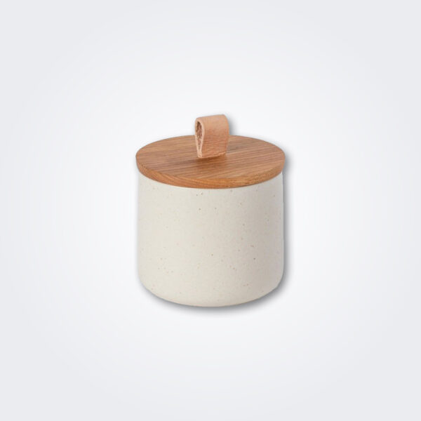 Small stoneware canister with wood lid product picture.
